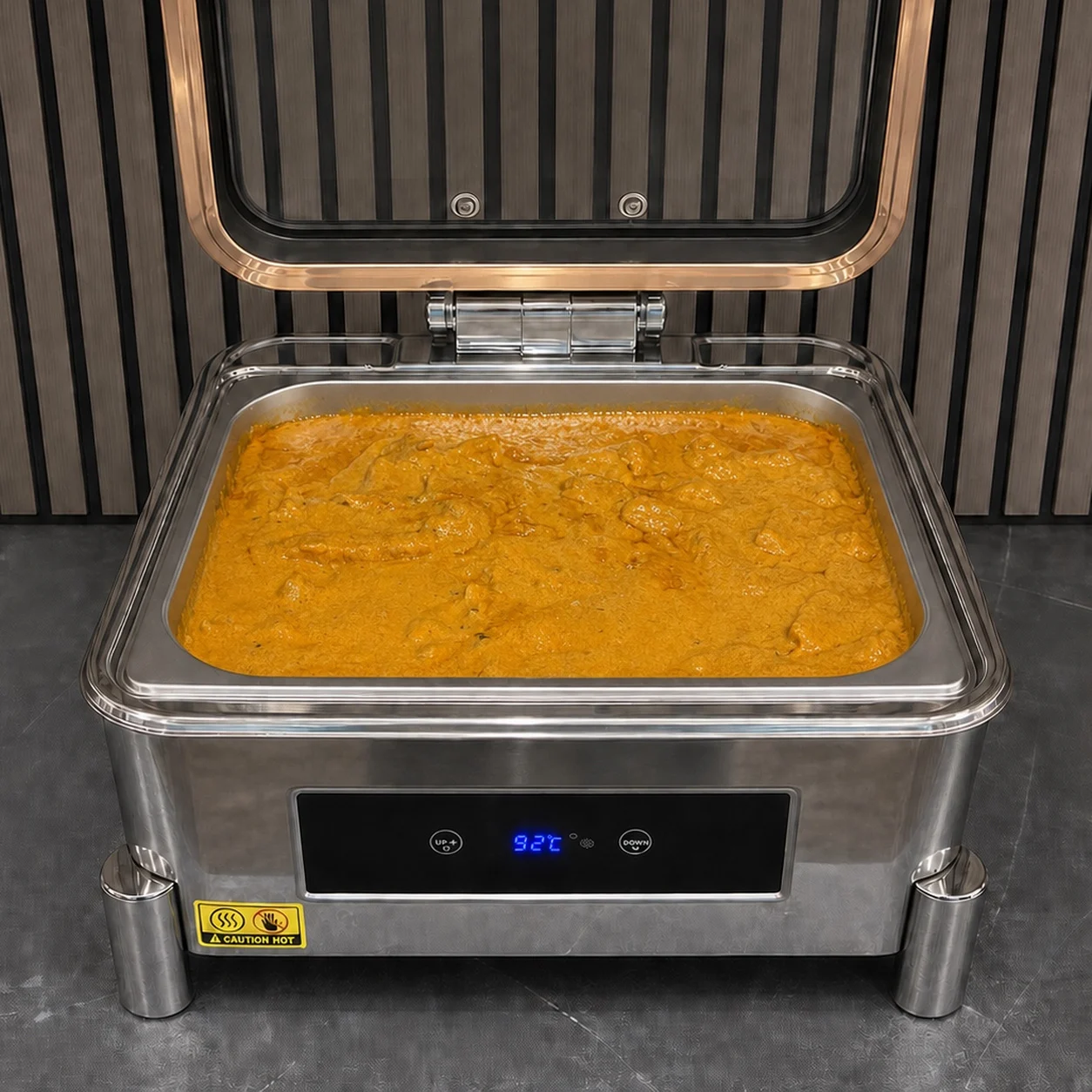 Butter chicken served in a buffet chafing dish